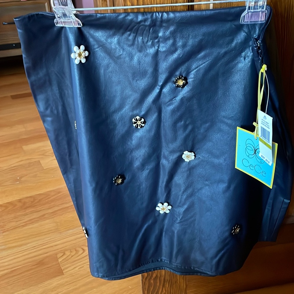Short skirt navy blue neck not sure if it’s leather